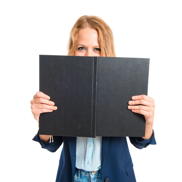 Chica con libro sobre fondo blanco Imágenes de stock libres de derechos