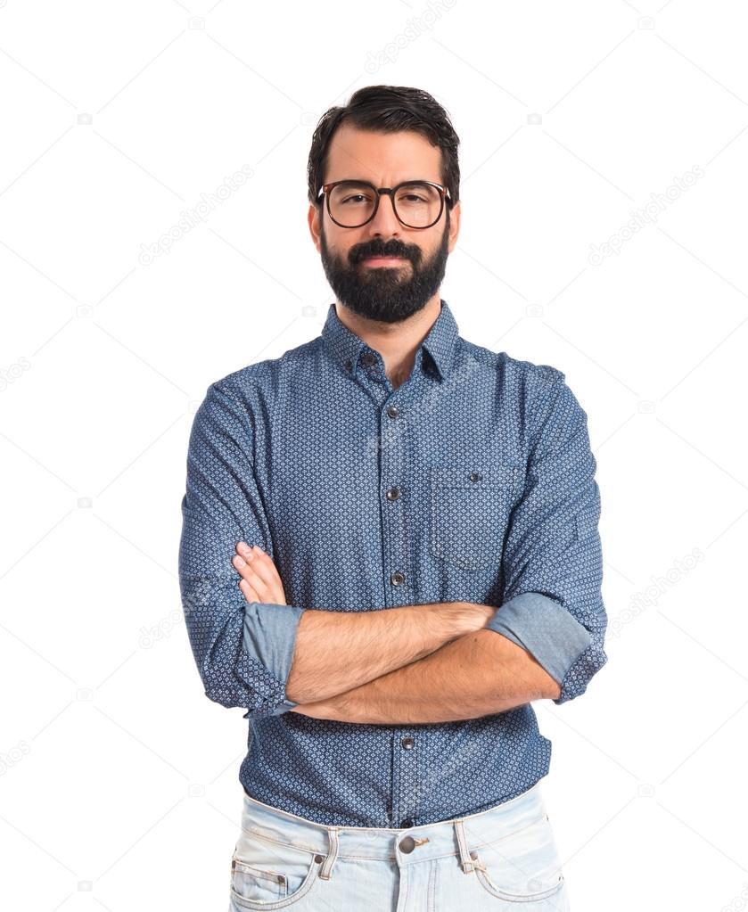 Young hipster man with his arms crossed