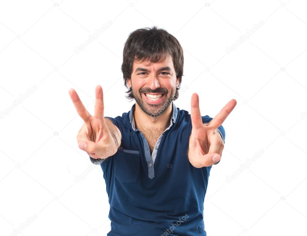 Man with thumb up over white background 