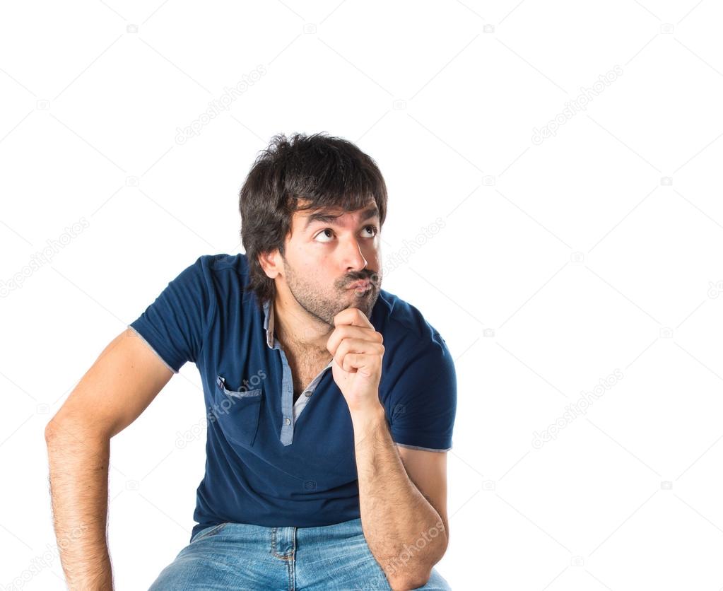 Man thinking over isolated white background