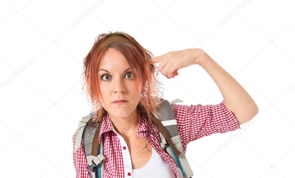 backpacker making crazy gesture over white background