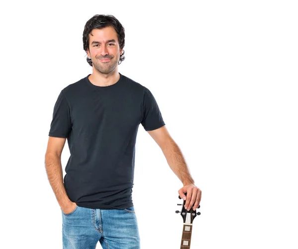 Schöner Mann mit Gitarre vor weißem Hintergrund — Stockfoto
