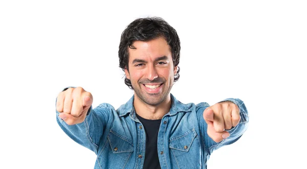 Man pointing to the front over white background — Stock Photo, Image