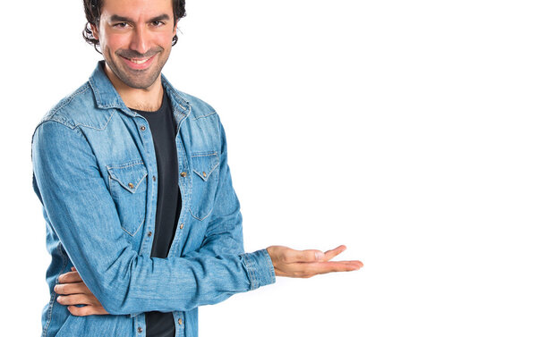 Man presenting something over isolated white background