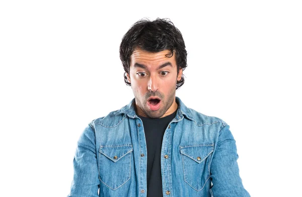 Surprised man reading a book over white background — Stock Photo, Image