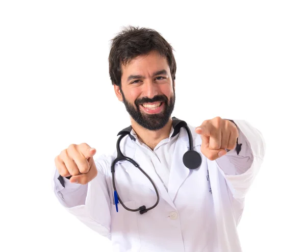 Doctor pointing to the front over white background — Stock Photo, Image