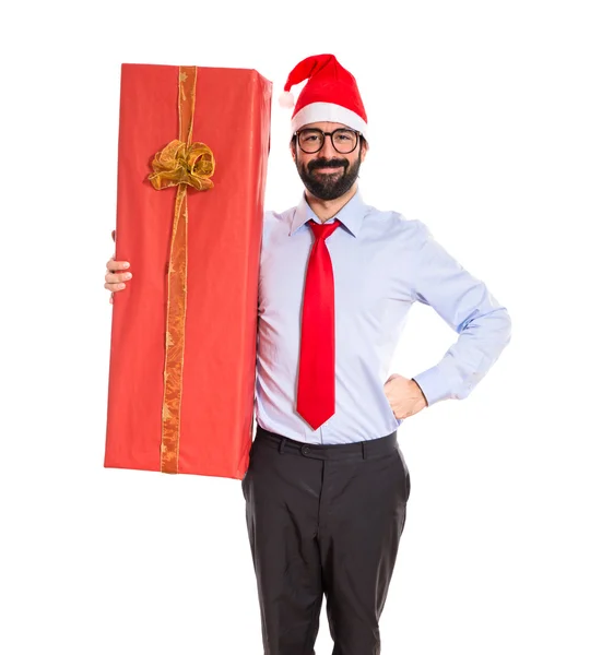 Businessman with gift over white — Stock Photo, Image