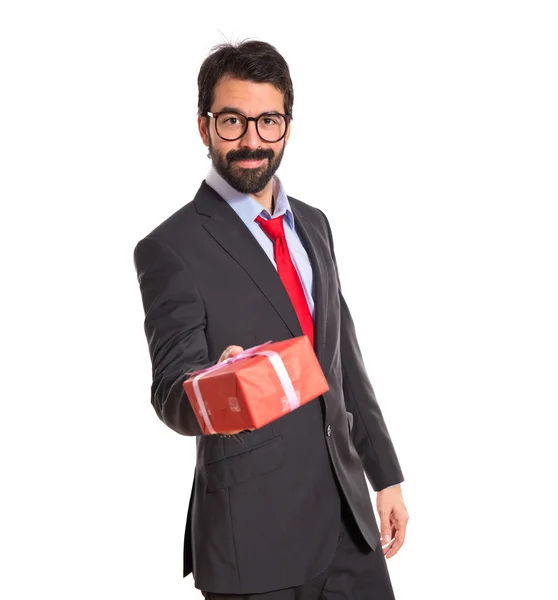 Businessman with several gifts — Stock Photo, Image