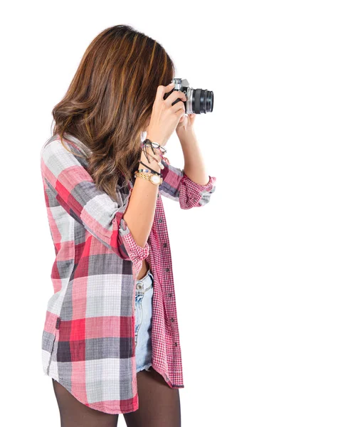Pretty girl photographing over white background — Stock Photo, Image
