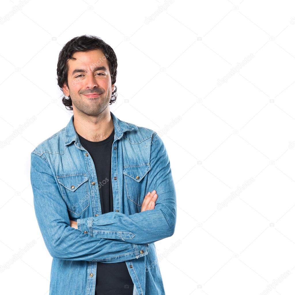 Man with his arms crossed over white background