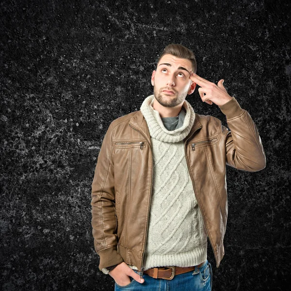 Handsome man making suicide gesture over white background — Stock Photo, Image
