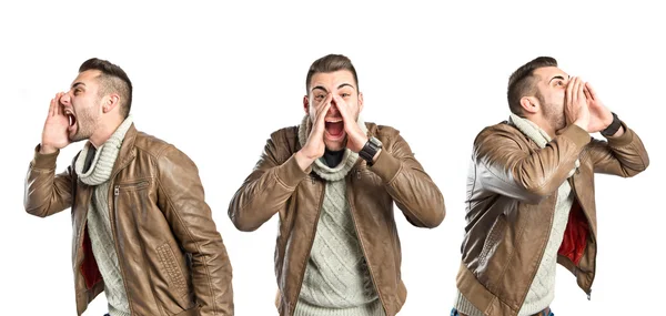 Young man screaming over isolated white background — Stock Photo, Image