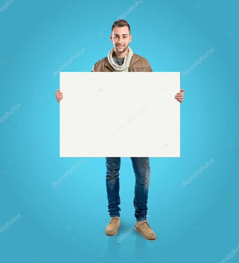 Man with empty placard over blue background