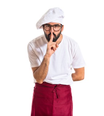 Şef yapım sessizlik jest beyaz arka plan üzerinde