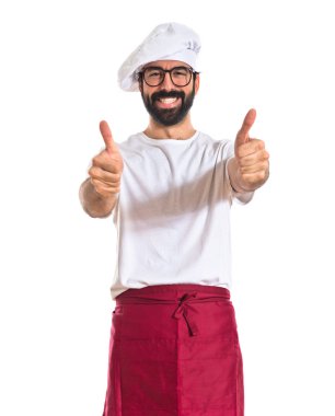 Şef ile beyaz arka plan üzerinde başparmak