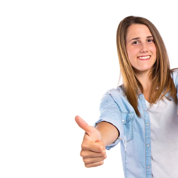 Menina com polegares para cima sobre fundo branco — Fotografia de Stock