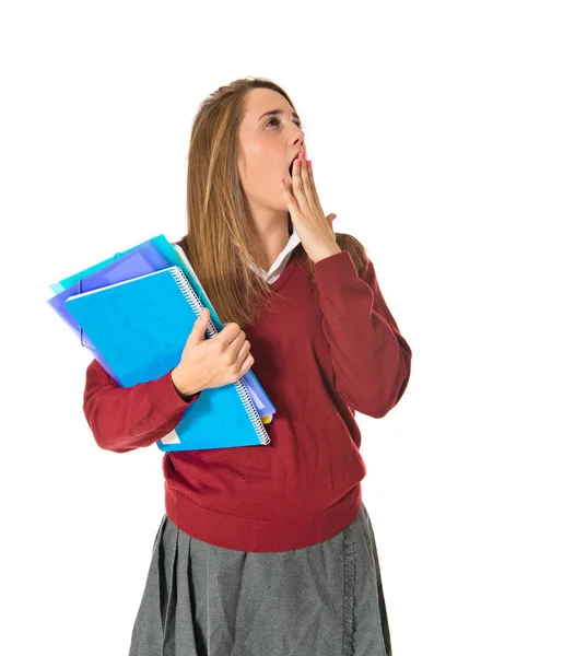 Estudiante bostezando sobre fondo blanco aislado — Foto de Stock