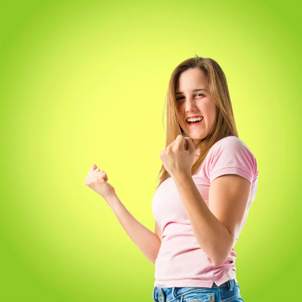 Lucky girl over green background — Stock Photo, Image