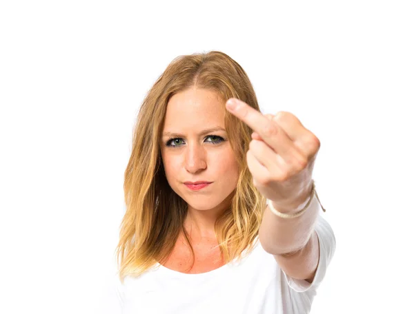 Girl making horn gesture over white background — Stock Photo, Image