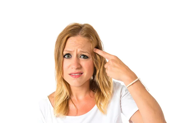 Woman making crazy gesture over white background — Stock Photo, Image