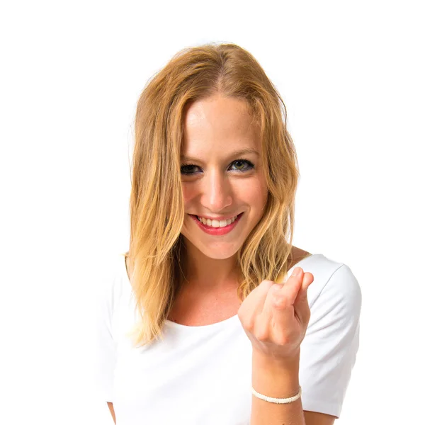 Girl doing a money gesture over white background — Stock Photo, Image