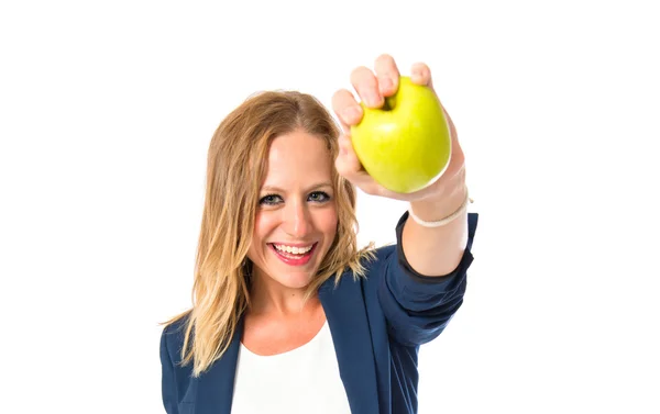 白い背景の上のリンゴを保持しているブロンドの女の子 — ストック写真