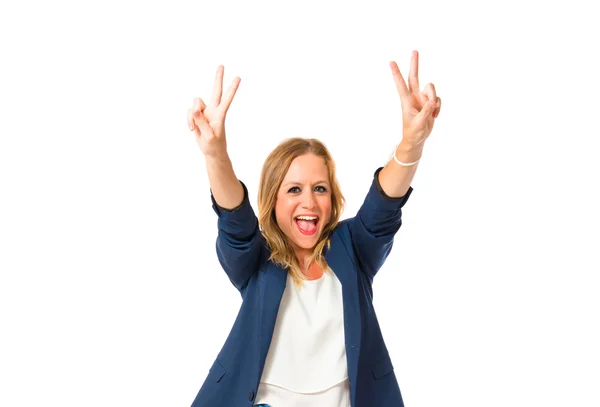 Woman doing victory gesture over white background — Stock Photo, Image