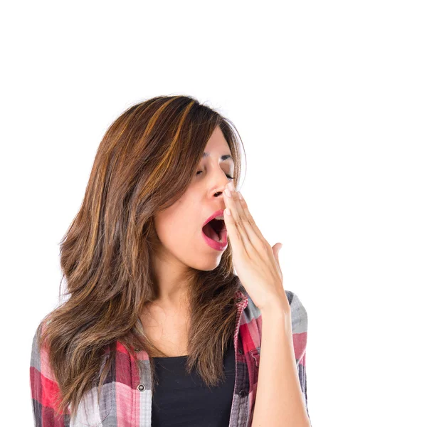 Girl yawning over isolated white background — Stock Photo, Image