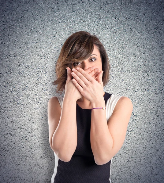 Women with her mouth closed by her hands — Stock Photo, Image