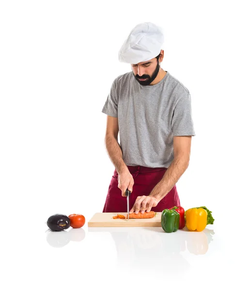 Chef cutting a carrot — Stock Photo, Image
