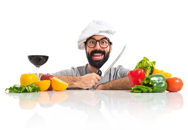 Chef hipster fou avec plusieurs légumes et fruits — Photo