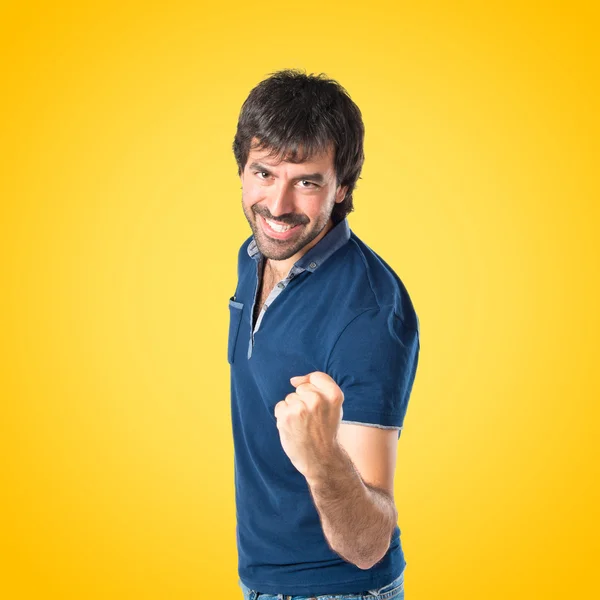 Lucky Man over yellow background — Stock Photo, Image