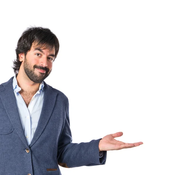 Handsome man having doubts over isolated white background — Stock Photo, Image