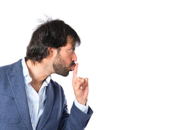 Homem fazendo gesto de silêncio sobre fundo branco isolado — Fotografia de Stock