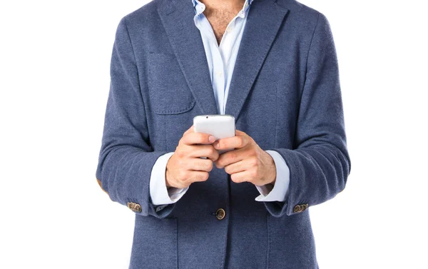 Brunetteman talking to mobile over white background — Stock Photo, Image