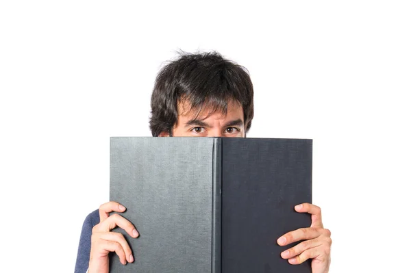 Podnikatel, čtení knihy nad bílým pozadím — Stock fotografie