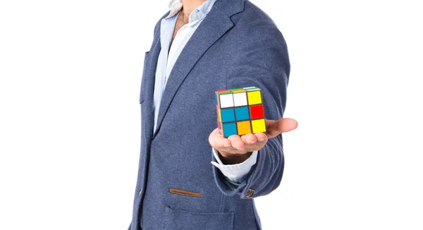 Happy man playing an intelligence game over white backgrpund — Stock Photo, Image