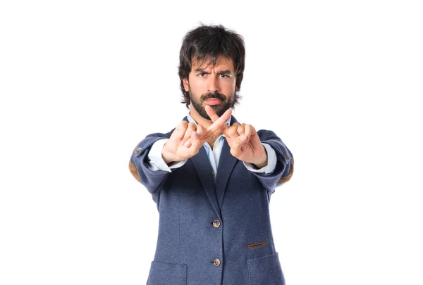 Handsome man doing NO gesture over white background — Stock Photo, Image