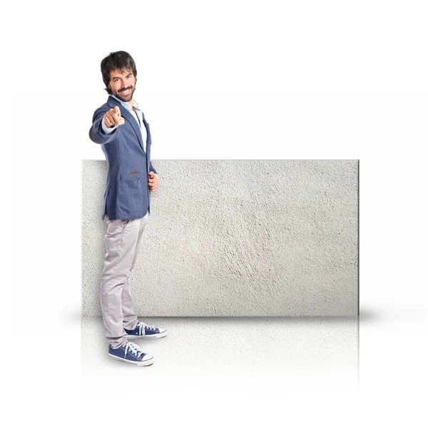 Businessman pointing to the front with rectangular placard — Stock Photo, Image