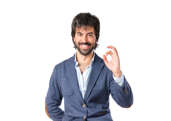 Businessman making Ok sign over white background — Stock Photo, Image