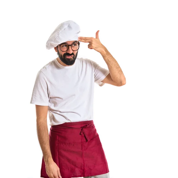 Koch macht Selbstmordgeste vor weißem Hintergrund — Stockfoto