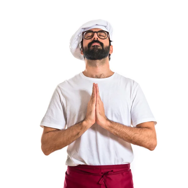 Chef en position zen sur fond blanc — Photo