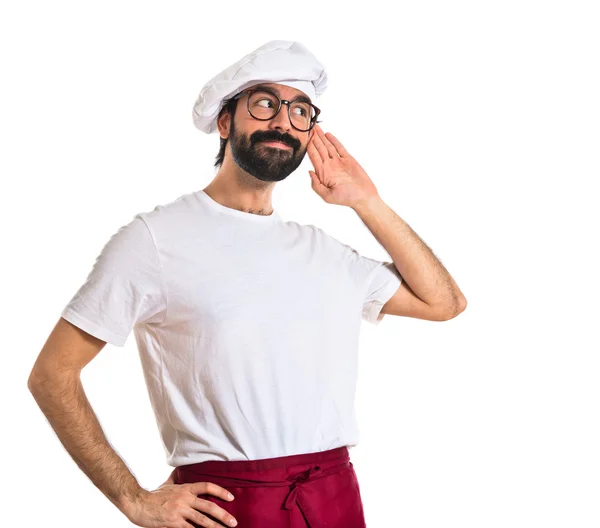 Chef listening over white background — Stock Photo, Image