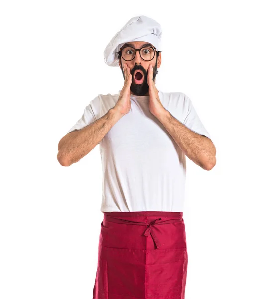 Chef-kok doet verrassing gebaar op witte achtergrond — Stockfoto