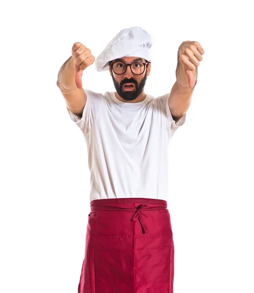 Chef doing a bad signal over white background — Stock Photo, Image