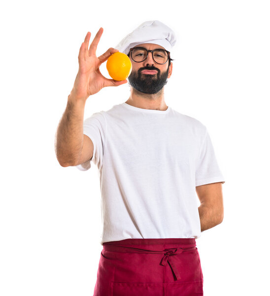 Chef holding a lemon