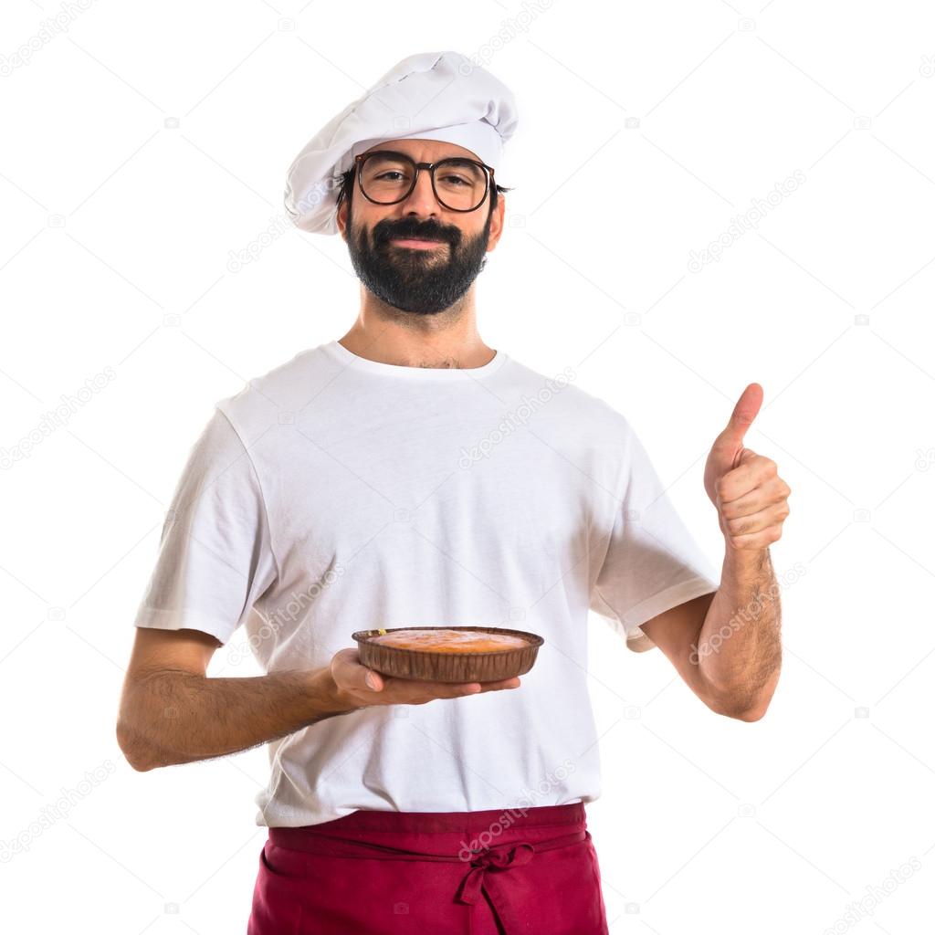 Chef holding cake