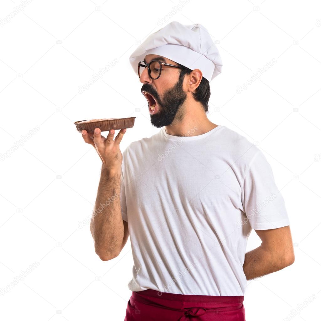 Chef eating a cake