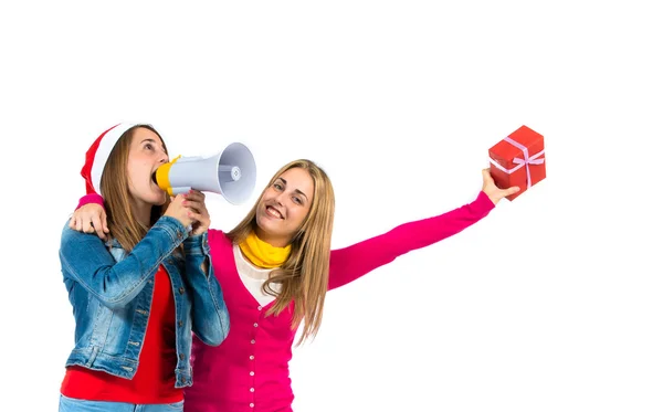 Christmas women holding gifts over white background — Stock Photo, Image