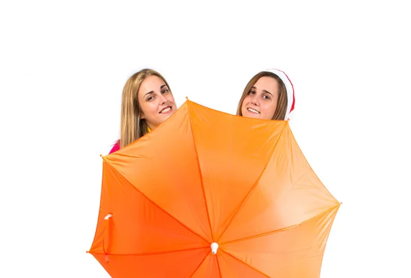 Mulheres de Natal com guarda-chuva sobre fundo branco — Fotografia de Stock